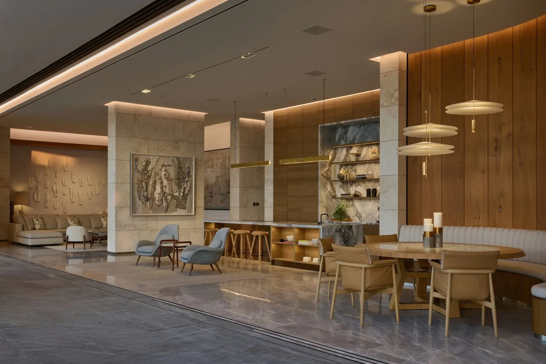 Marble lobby flex, then warm wood and stone so it’s not cold.