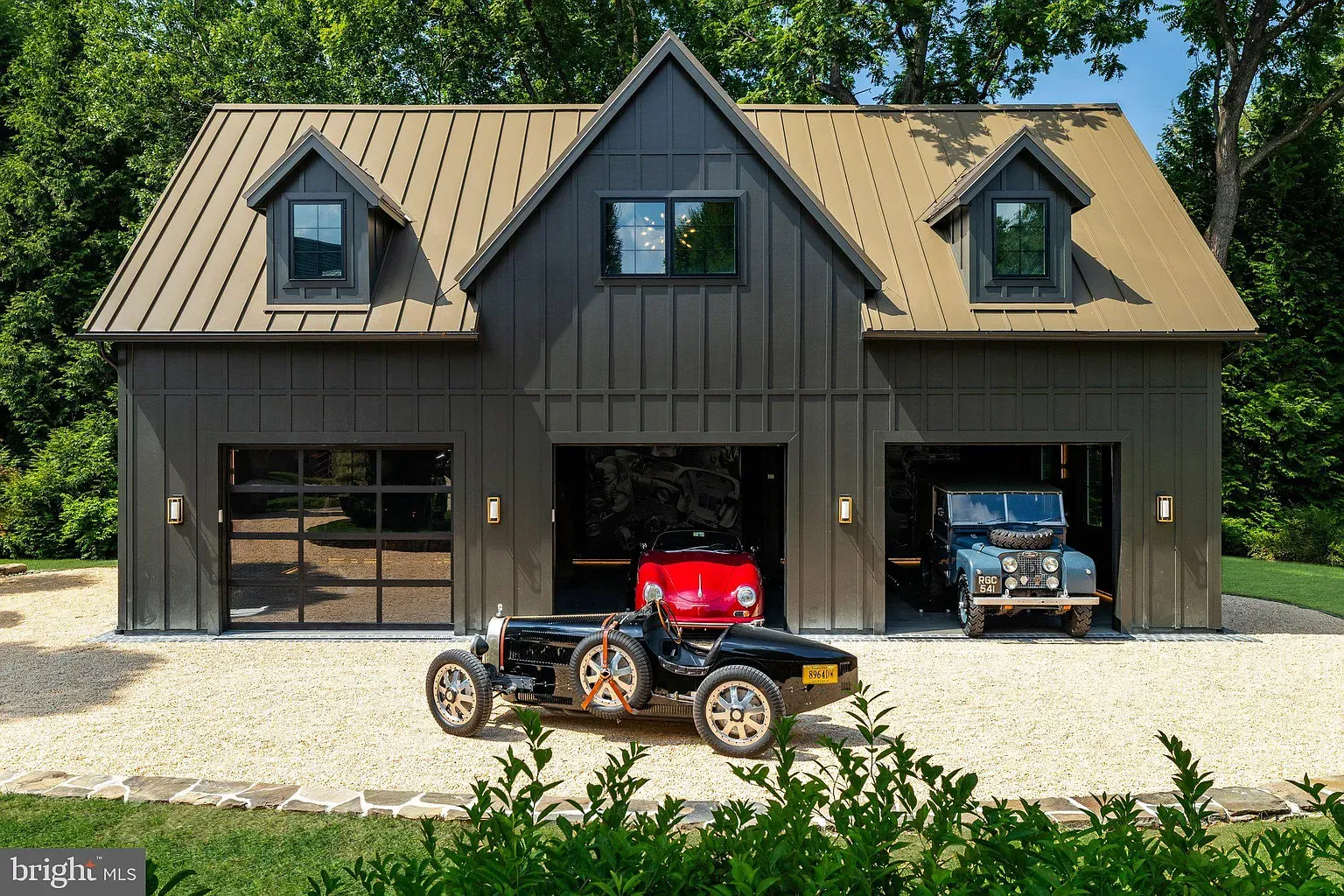 Black barn with a bronze roof. Slick, kinda moody.