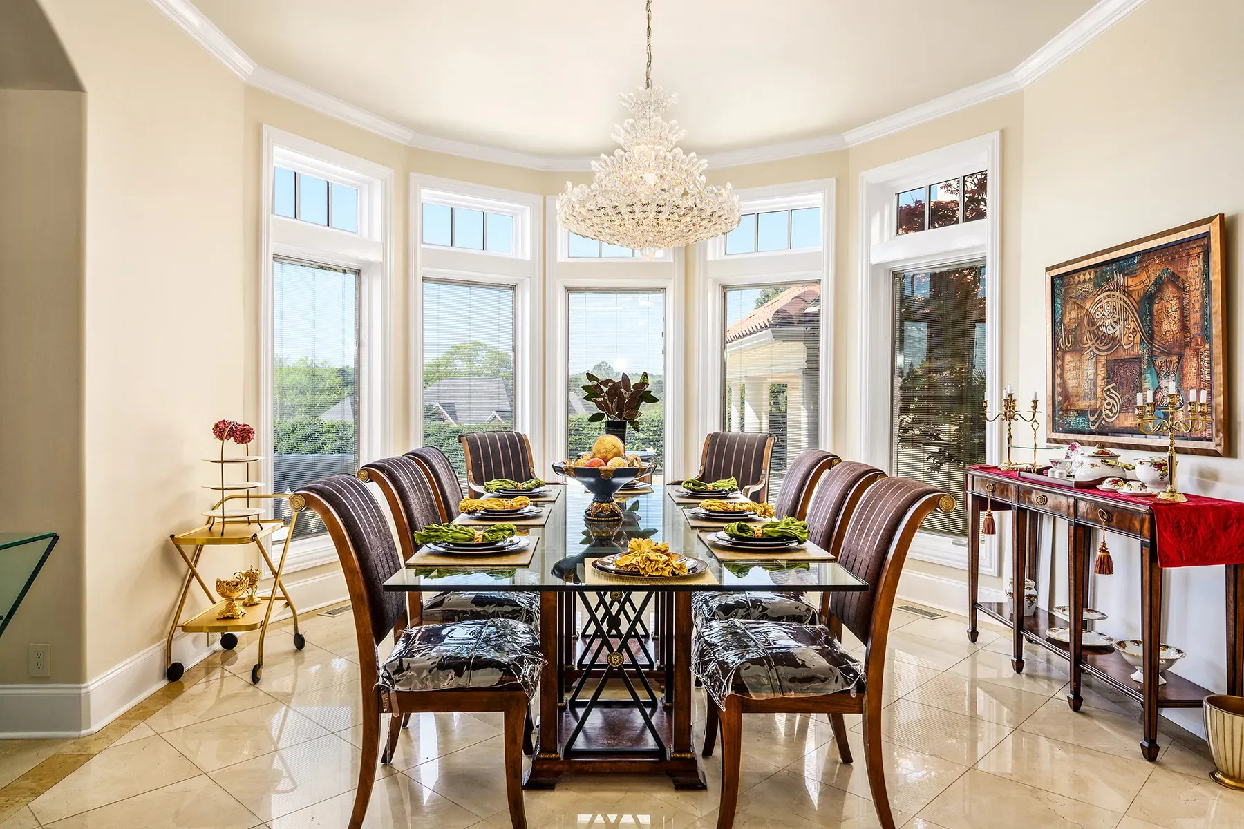 Here's the dining setup—glass table for ten, drenched in daylight.