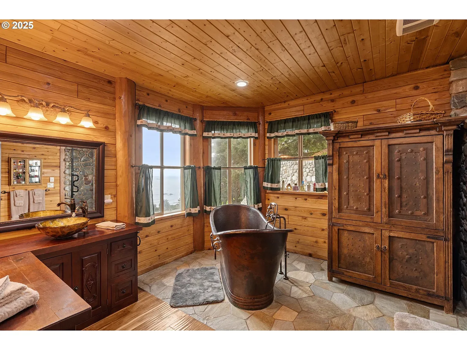Copper tub moment. Stone floor looks a spa cave, in a good way.