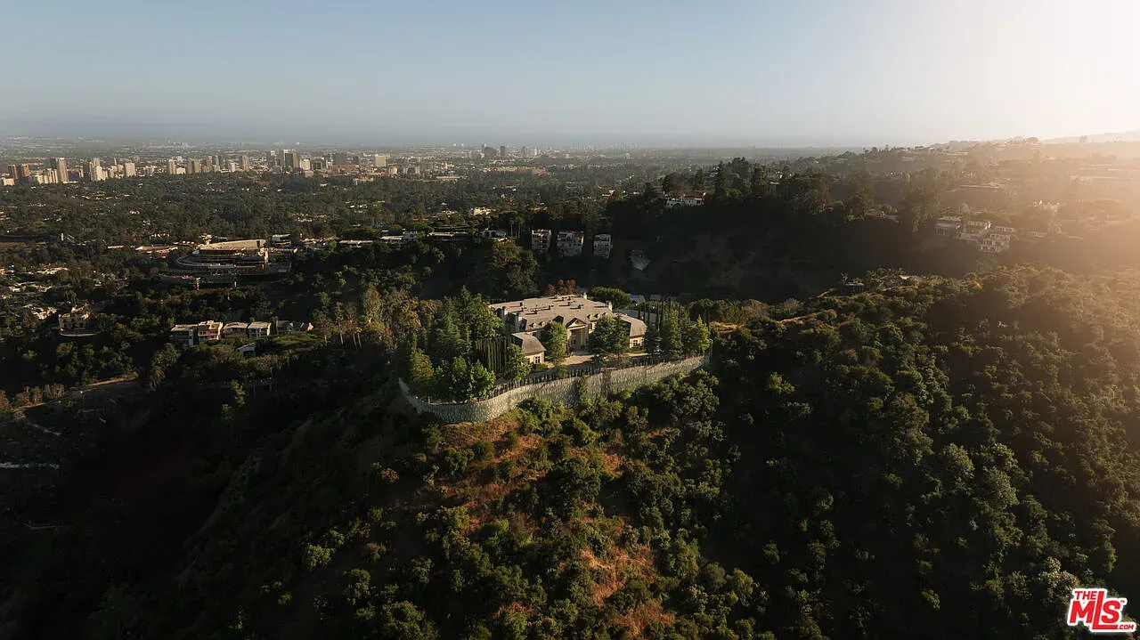Aerial peek. glassy hilltop lair. Views for days, wind for nights?
