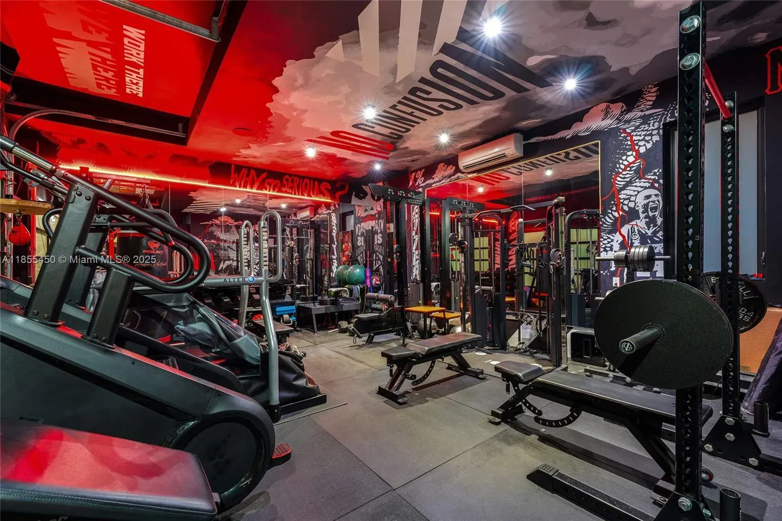 Home gym hits with red LEDs and murals. Motivating or nightclub?