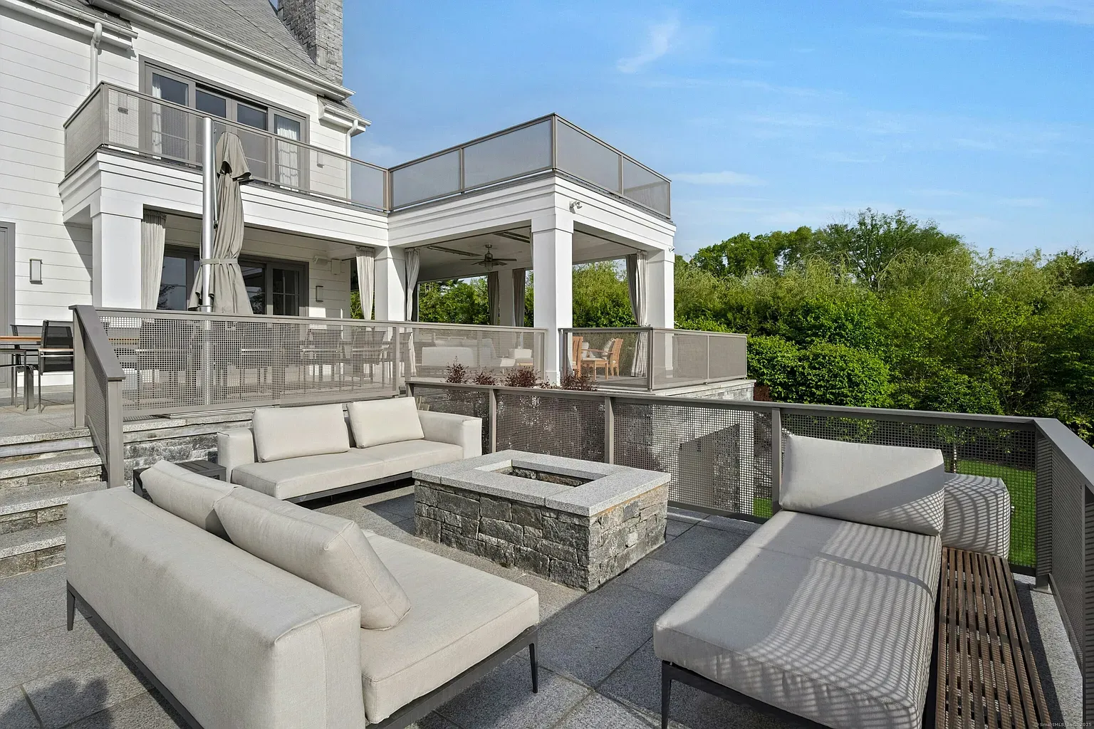 Here’s the terrace—sleek seating, light cushions, feels a hotel lounge.