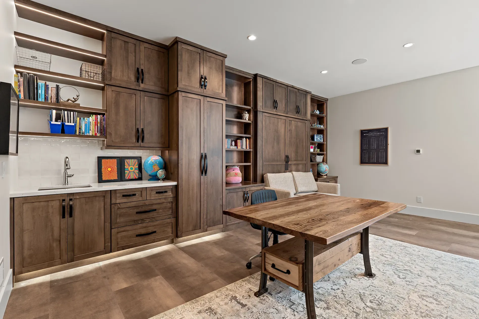 Office goals. wall-to-wall dark wood, books everywhere, little globes plotting trips.