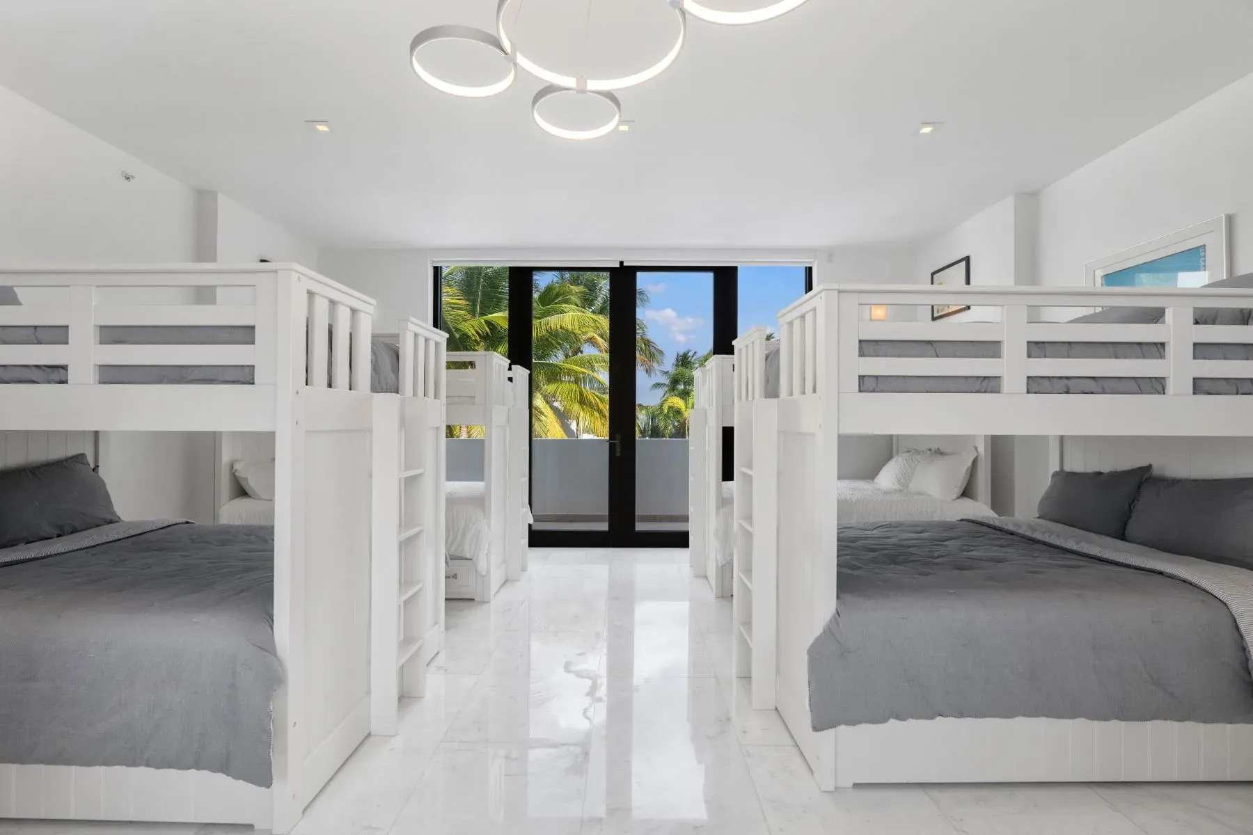 Big window, palm screensaver IRL. Minimal furniture, lots of light.