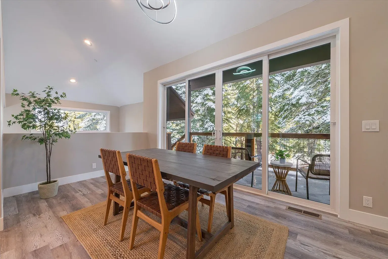 Easygoing dining area. Soft beige walls, natural textures, nothing fussy.