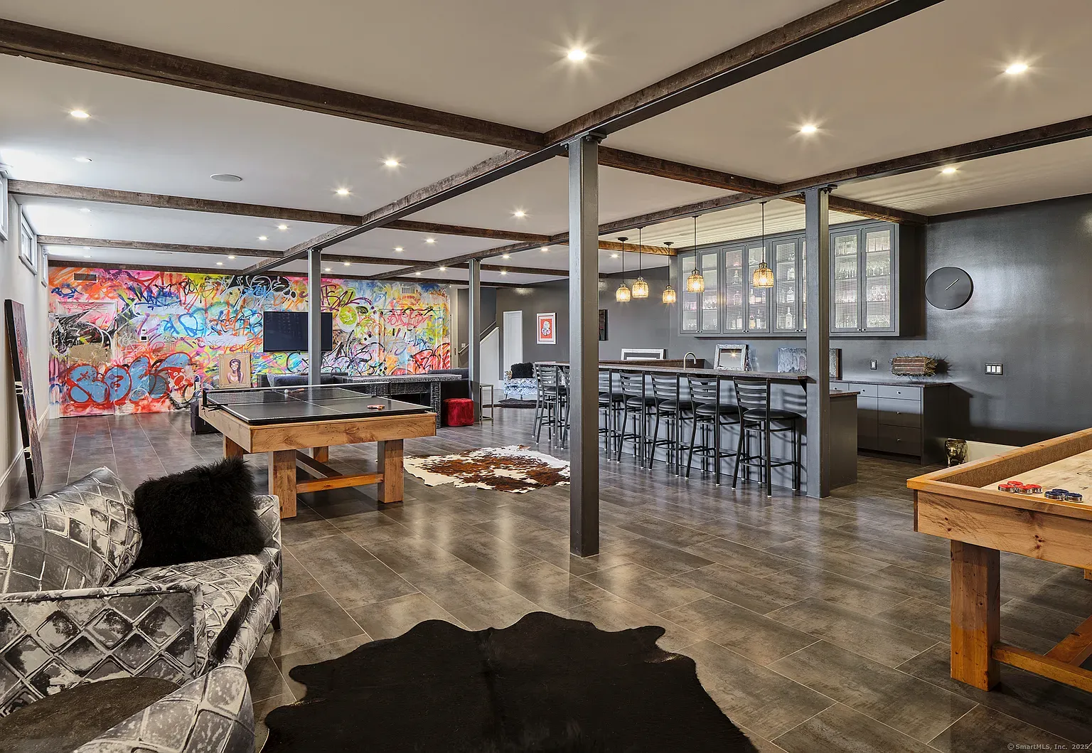 Industrial vibes, dark tile, bold art. I mean, cool, maybe too much?