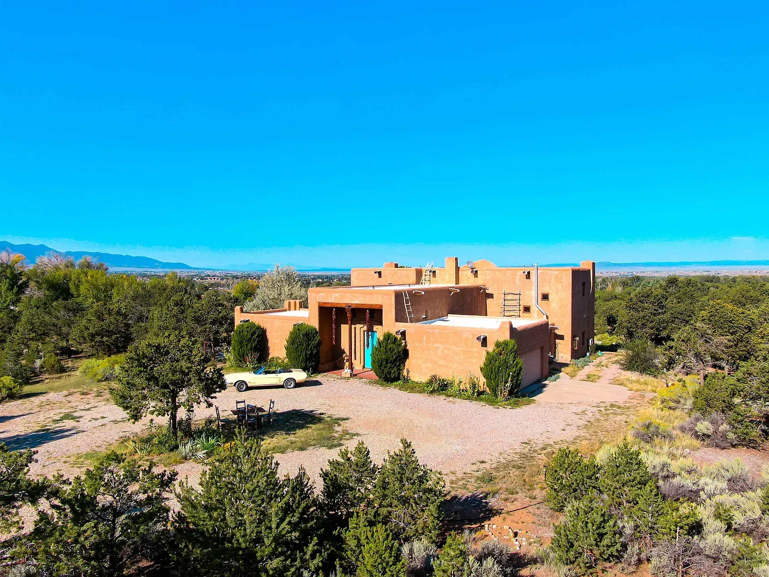 The whole Pueblo vibe, but tightened up. Warm terracotta against sandy stucco looks timeless.