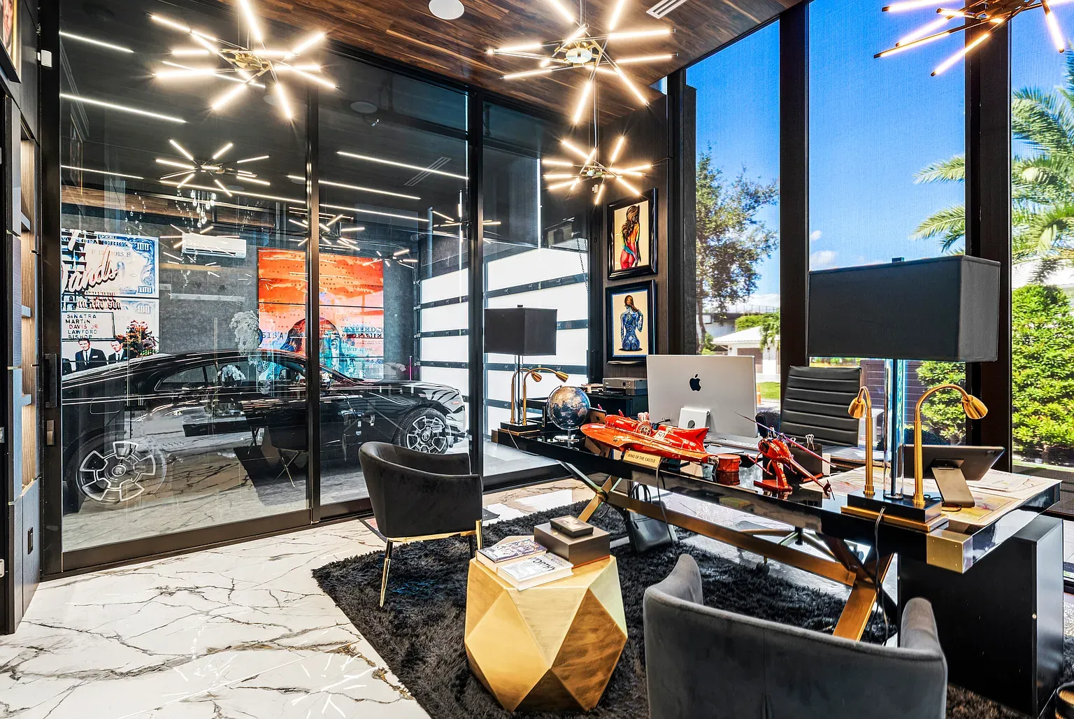 Office with a car as the backdrop. Subtle flex.