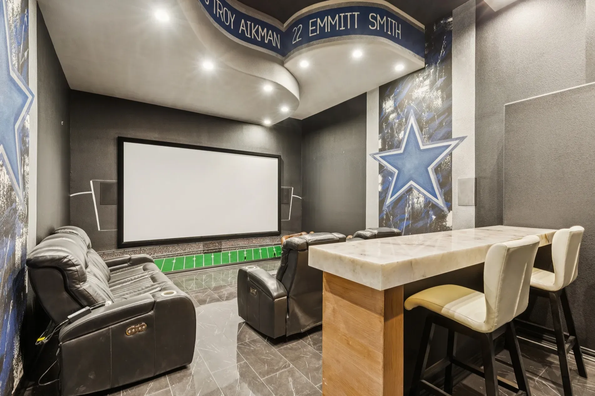 Cowboys theater room — charcoal and blue everywhere. I mean, committed. Too team-specific?