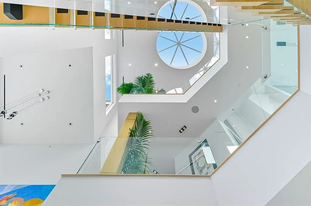 That spiral under the skylight feels museum energy at home.