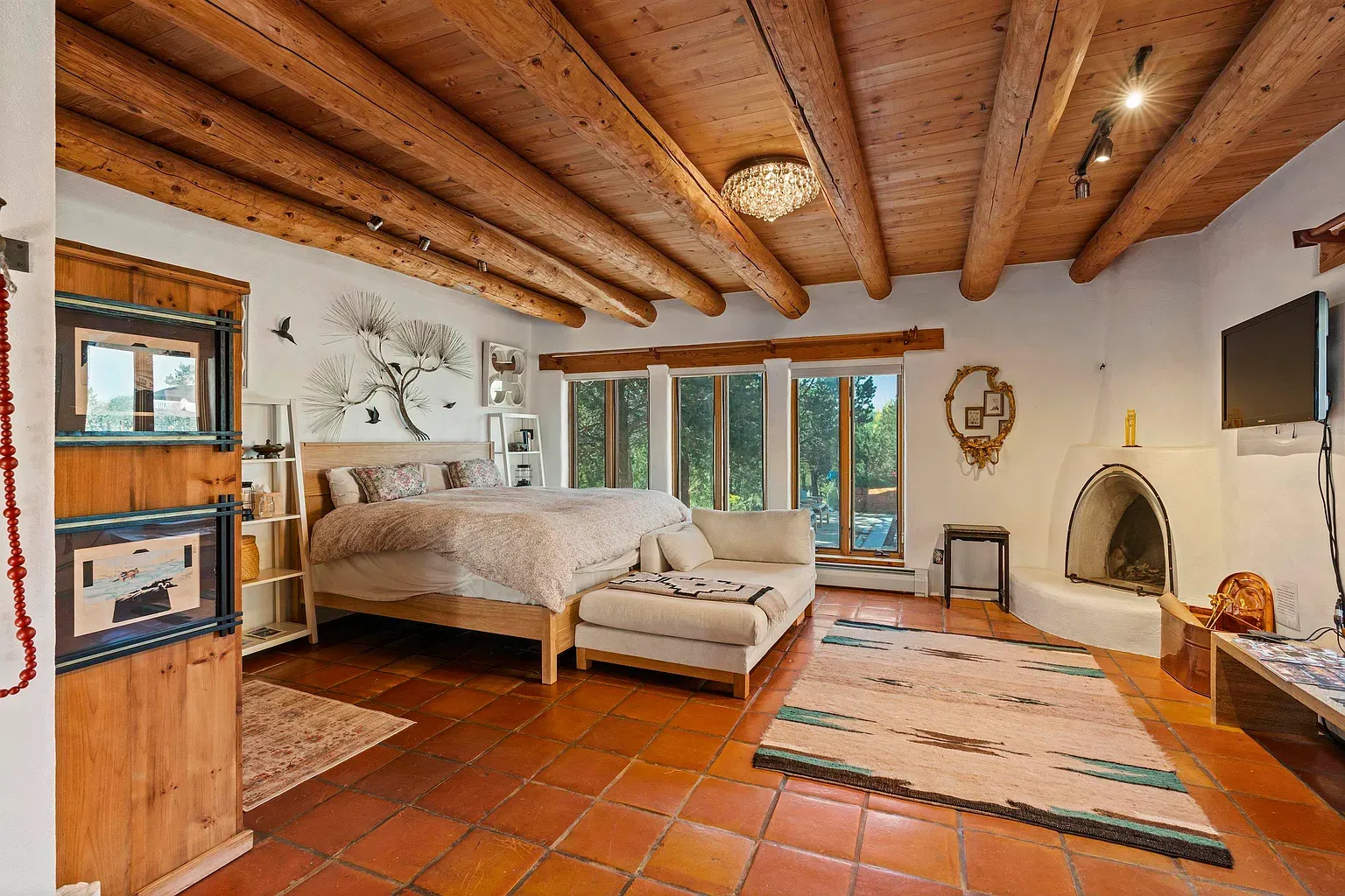 Terracotta floors and beams keep it grounded. Looks cool even on hot days.