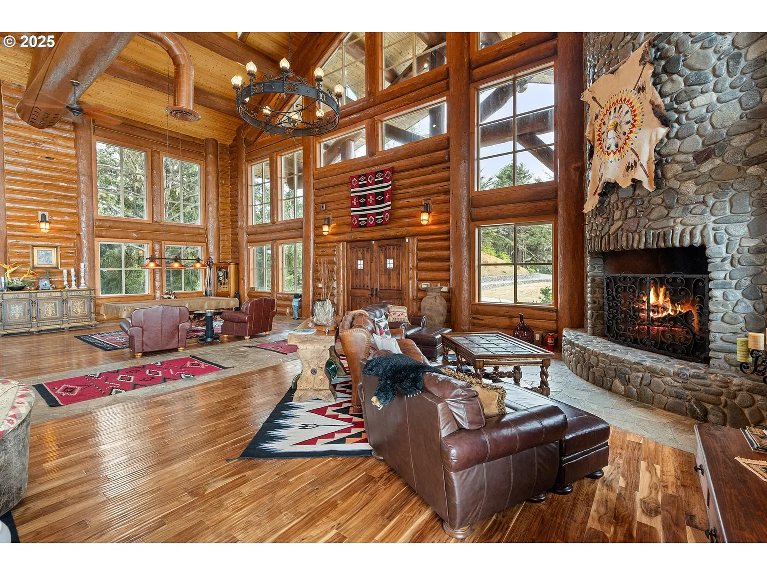 Another great room angle. Beams, glass, and a fireplace trying to steal the show.