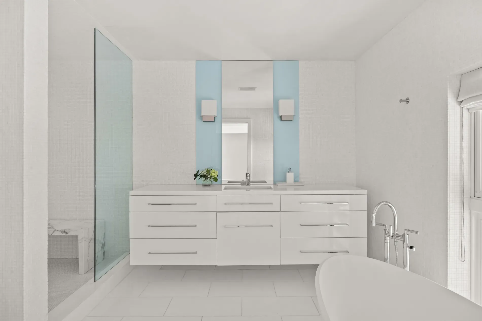 Glossy vanity with chrome pulls. Sleek, but fingerprints city?