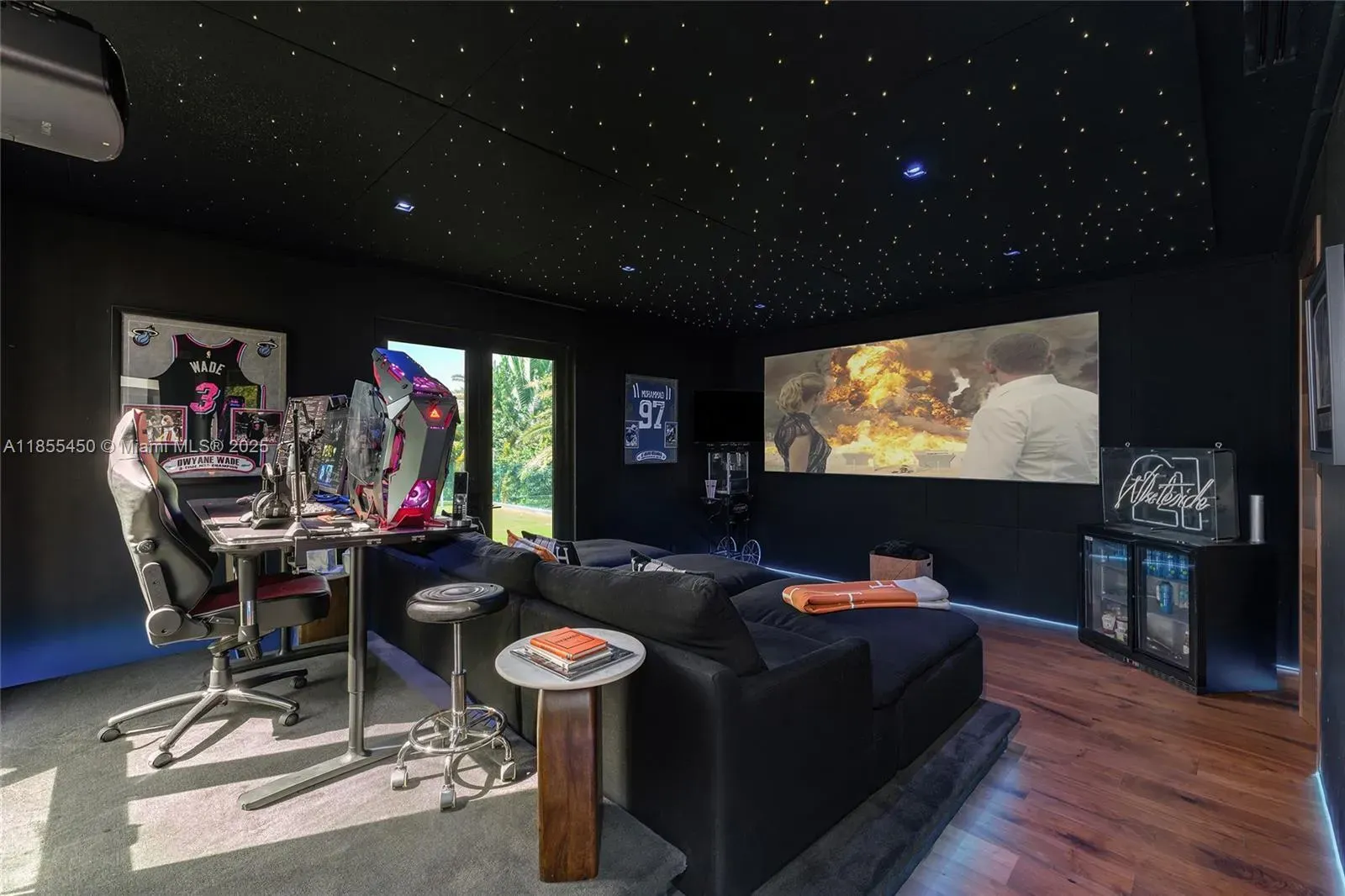 Gaming lounge again—black walls, twinkly ceiling. I mean, overkill or perfect?