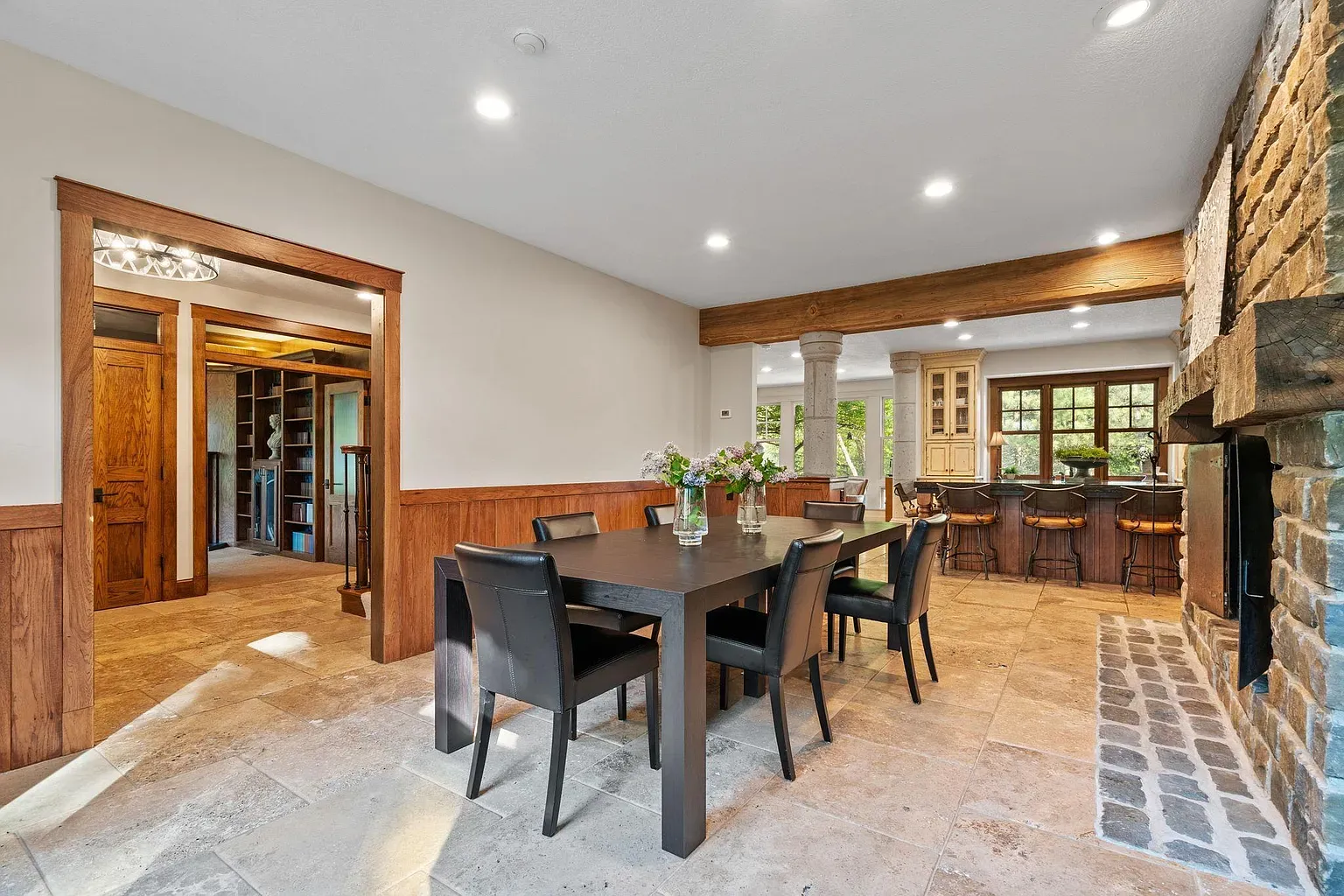 Modern chairs around a heavy table. stone floor ties it together.