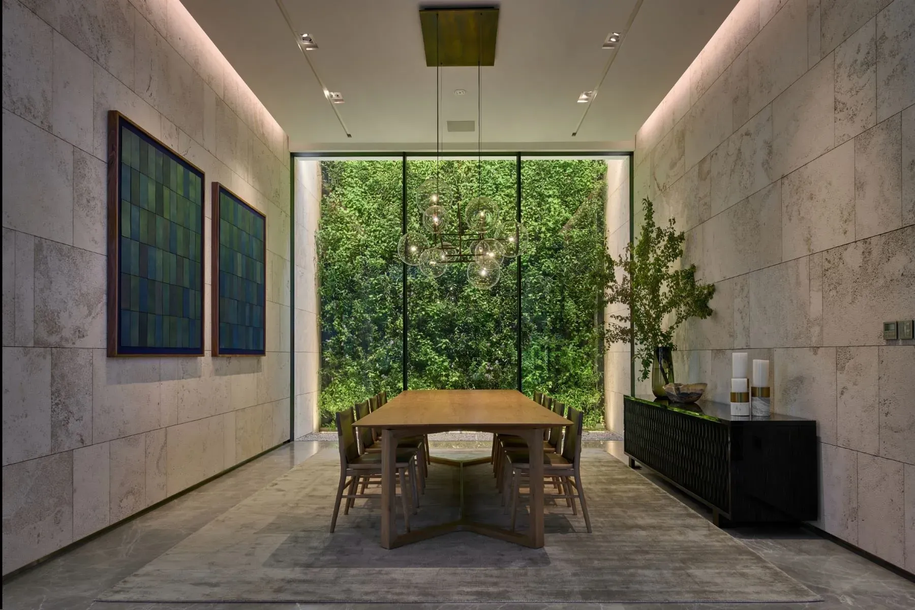 Dining’s all beige stone and texture. Calm, hotel-restaurant energy.
