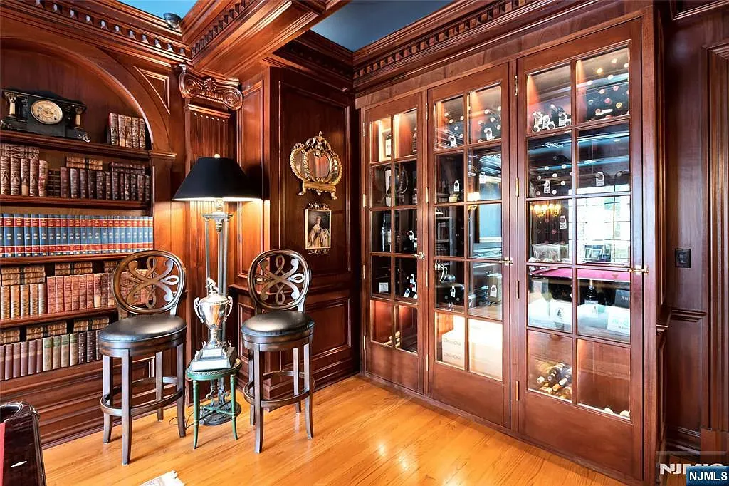 More mahogany, brass accents gleaming. Warm, slightly moody vibe.