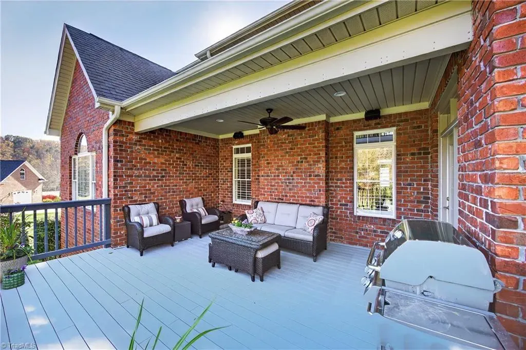 Brick courtyard energy with a sleek deck. Easy spot for weekend hangs.