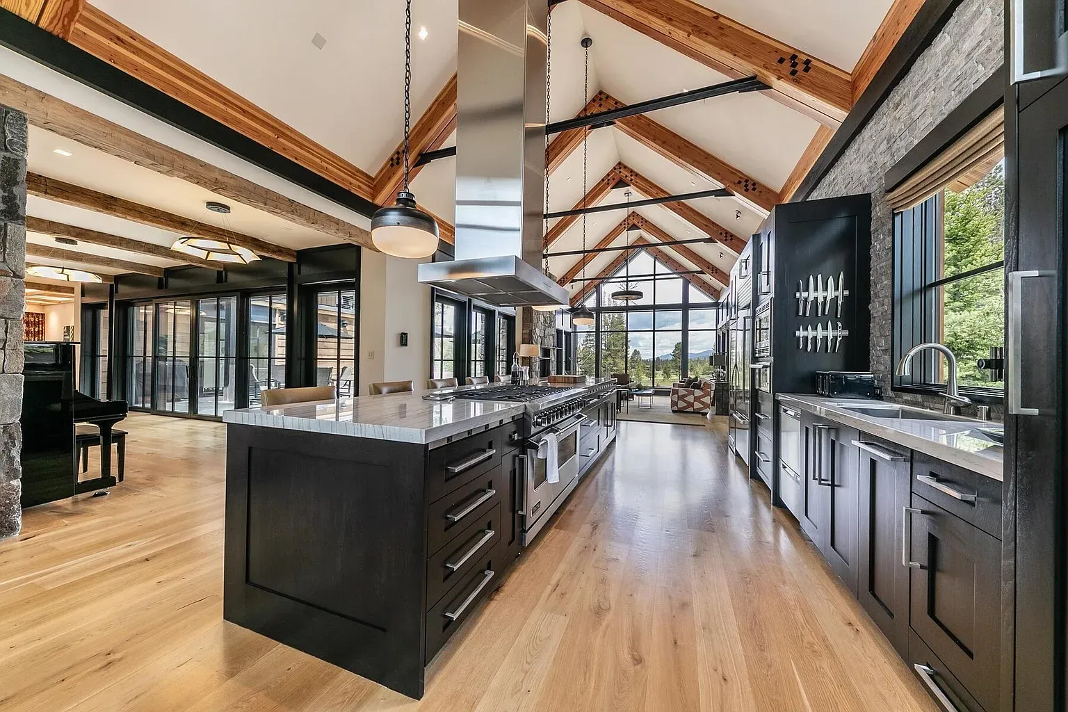 The kitchen’s huge and airy. Beams overhead, tons of workspace, zero clutter stress.