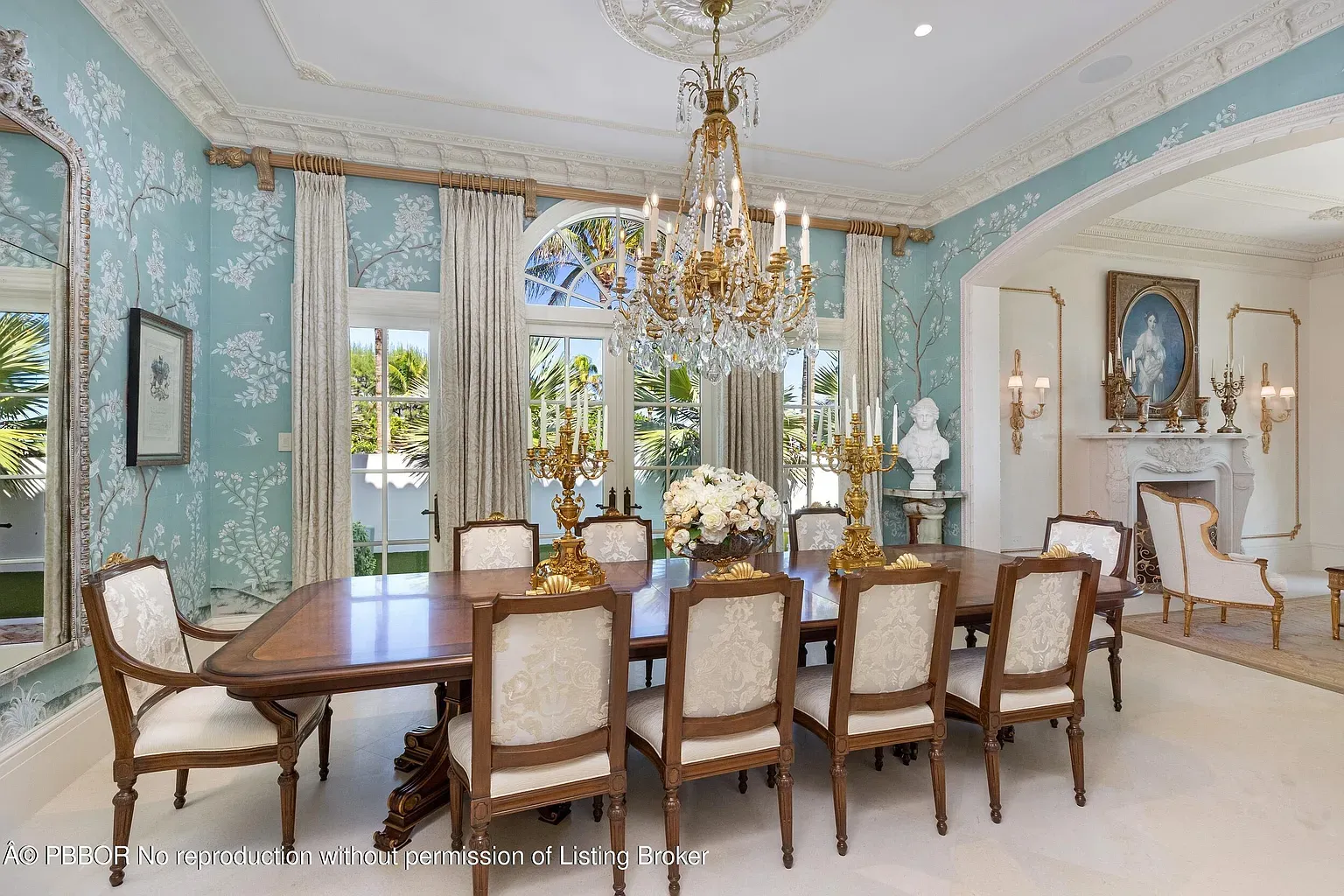 From this angle, the chandelier runs the room. Wallpaper feels gentle.