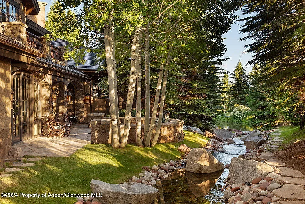 Stone exterior with aspens right up close. Mountain postcard stuff.