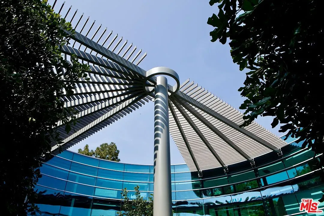 This circular canopy with the fan shade feels a bit sci fi resort.