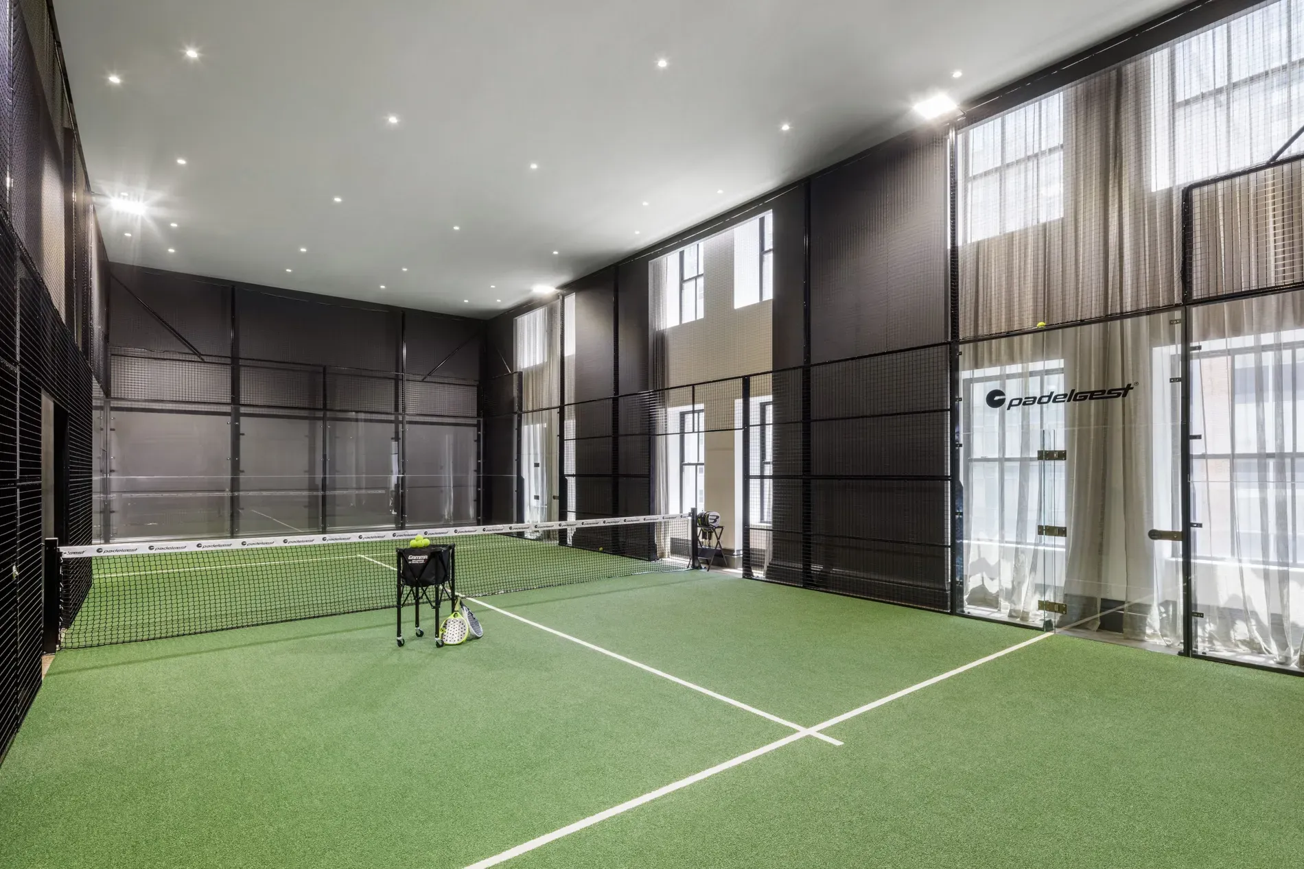 Synthetic grass court inside. Feels fun, but guessing it’s shared building amenity?