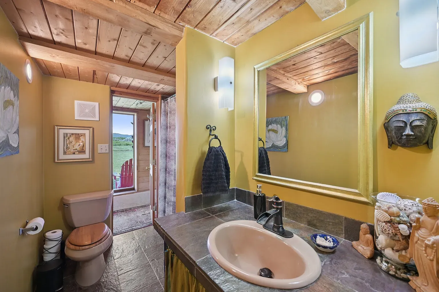 Yellow bathroom with timber beams. Sunny, earthy, morning coffee in paint form.