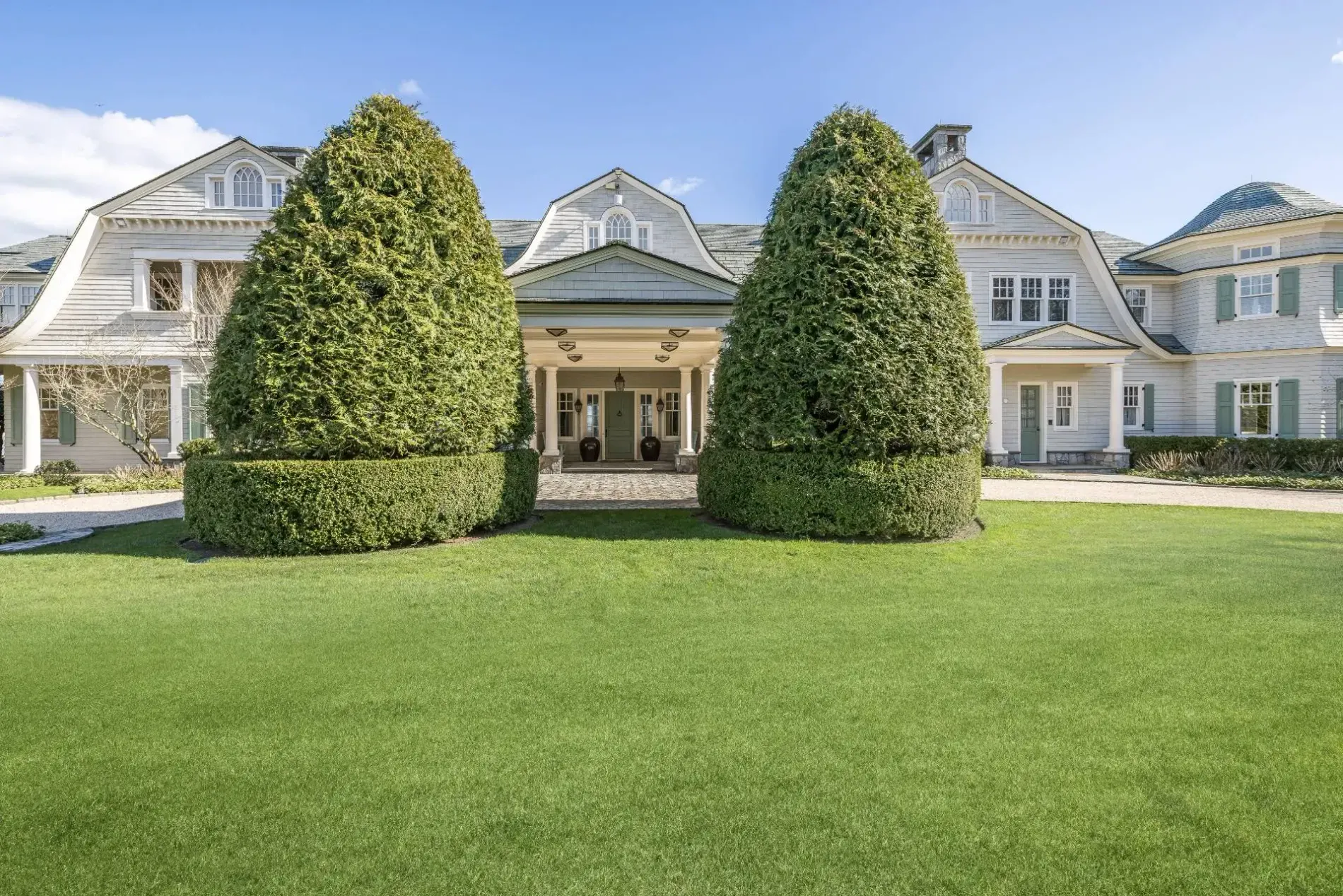 Entry flanked by those tall evergreens. Dramatic? Yeah. Maybe a tad formal.