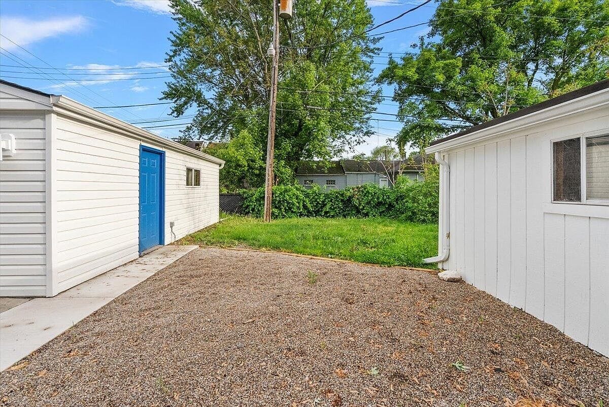 Paved side yard area leading to the garage