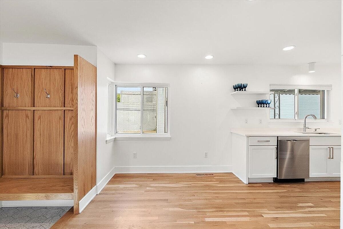 Empty dining area with wood partition near the front door
