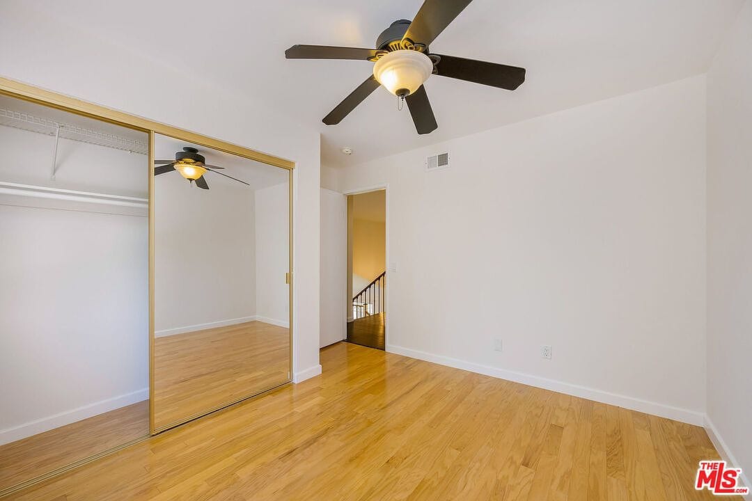 Upstairs bedroom with mirrored closet doors