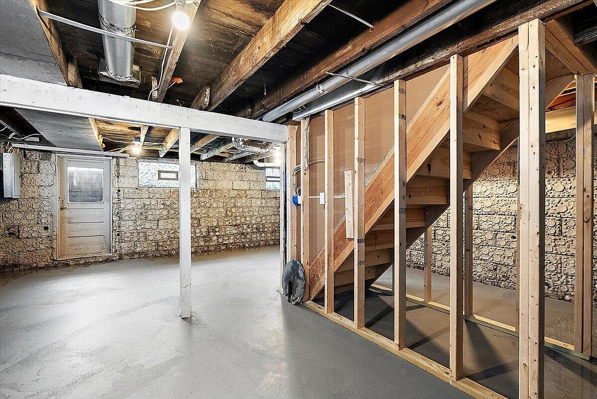 Wood framing for the stairs inside the unfinished basement