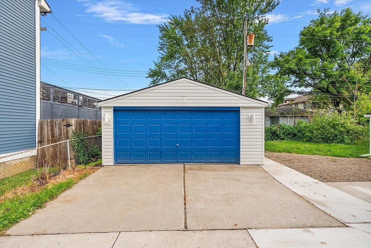 Front of the garage showing the bright blue door