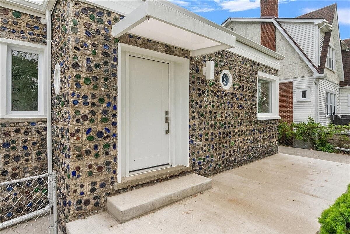 Close up of the front door showing the textured bottle wall