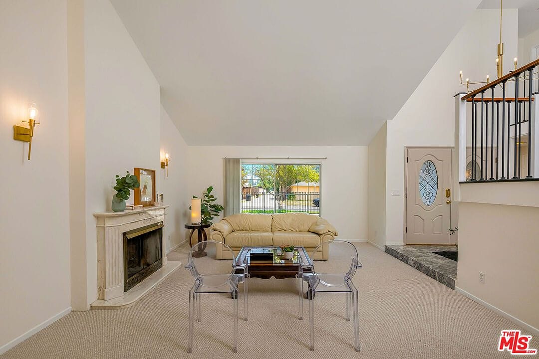 Wide shot of the living room looking toward the front entry