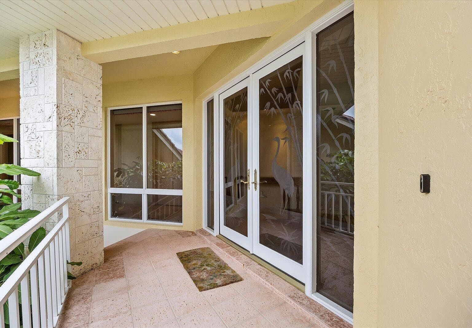 Double front doors with etched glass heron designs