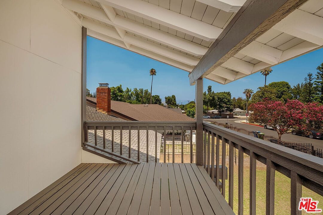 Small wooden balcony deck overlooking the front street