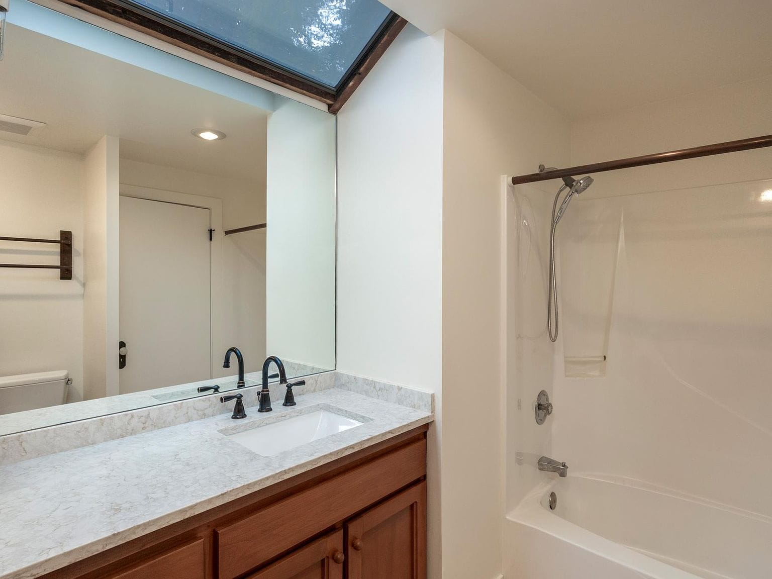 Bathroom, skylight over mirror