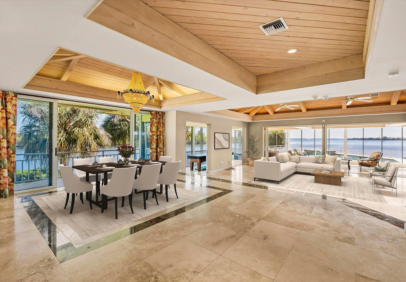 Dining room set with a wood ceiling and a crystal chandelier