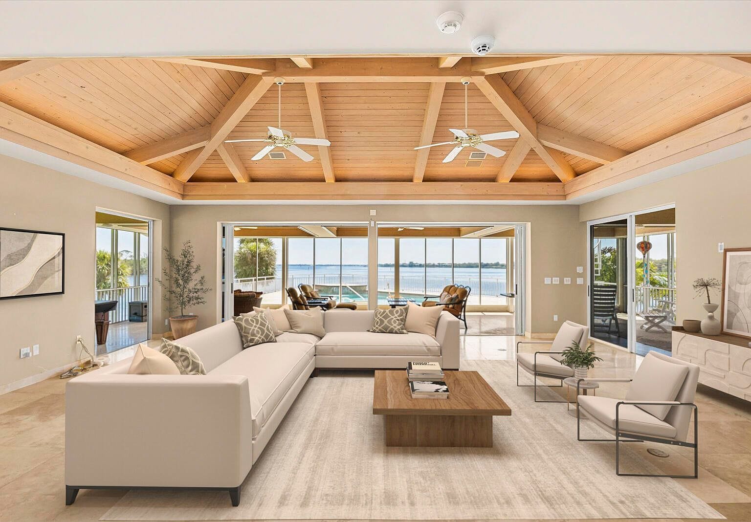 Living room with cozy couches under a massive wood ceiling