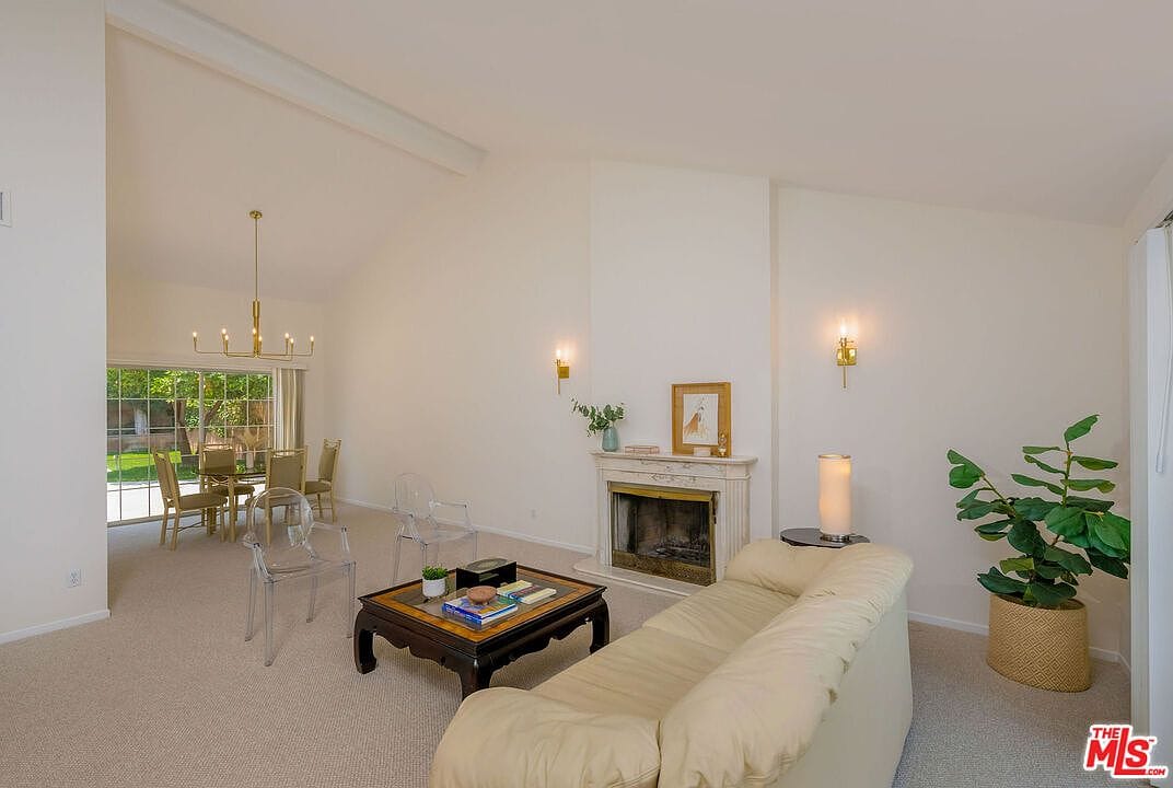 Alternative angle of the formal living room and fireplace