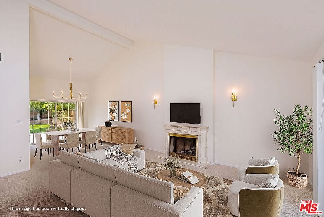 Formal living room with high ceilings and a fireplace