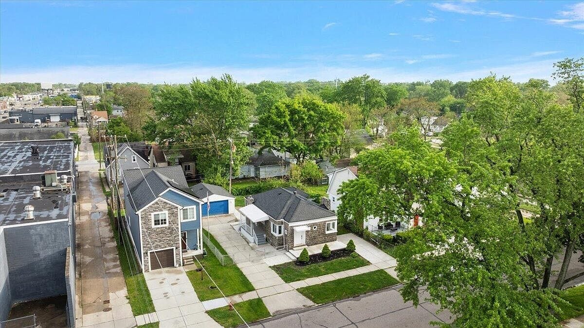 Aerial drone shot showing the street and surrounding homes
