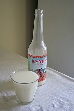 a traditional glass with fermented horse milk brew