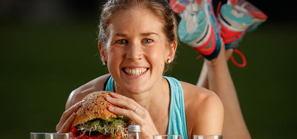 Athletes eating bread