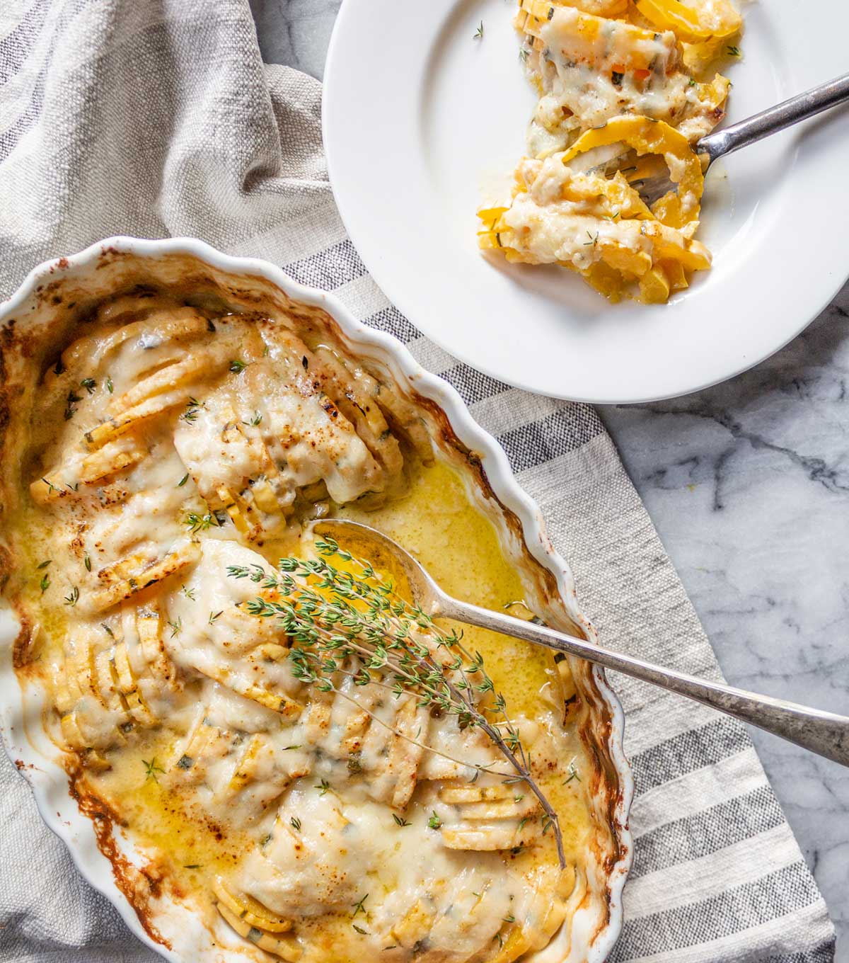 casserole bubbling in an oven with a melted Gruyere cheese top