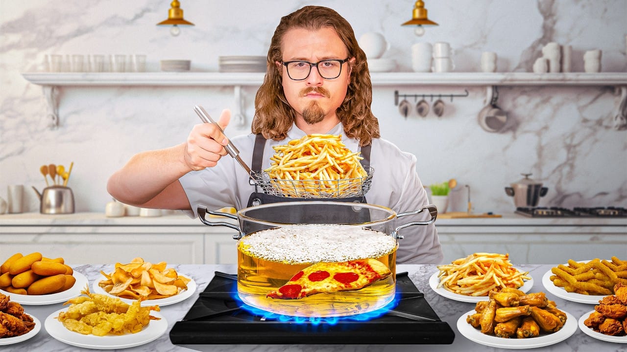 chef frying food in a deep fryer