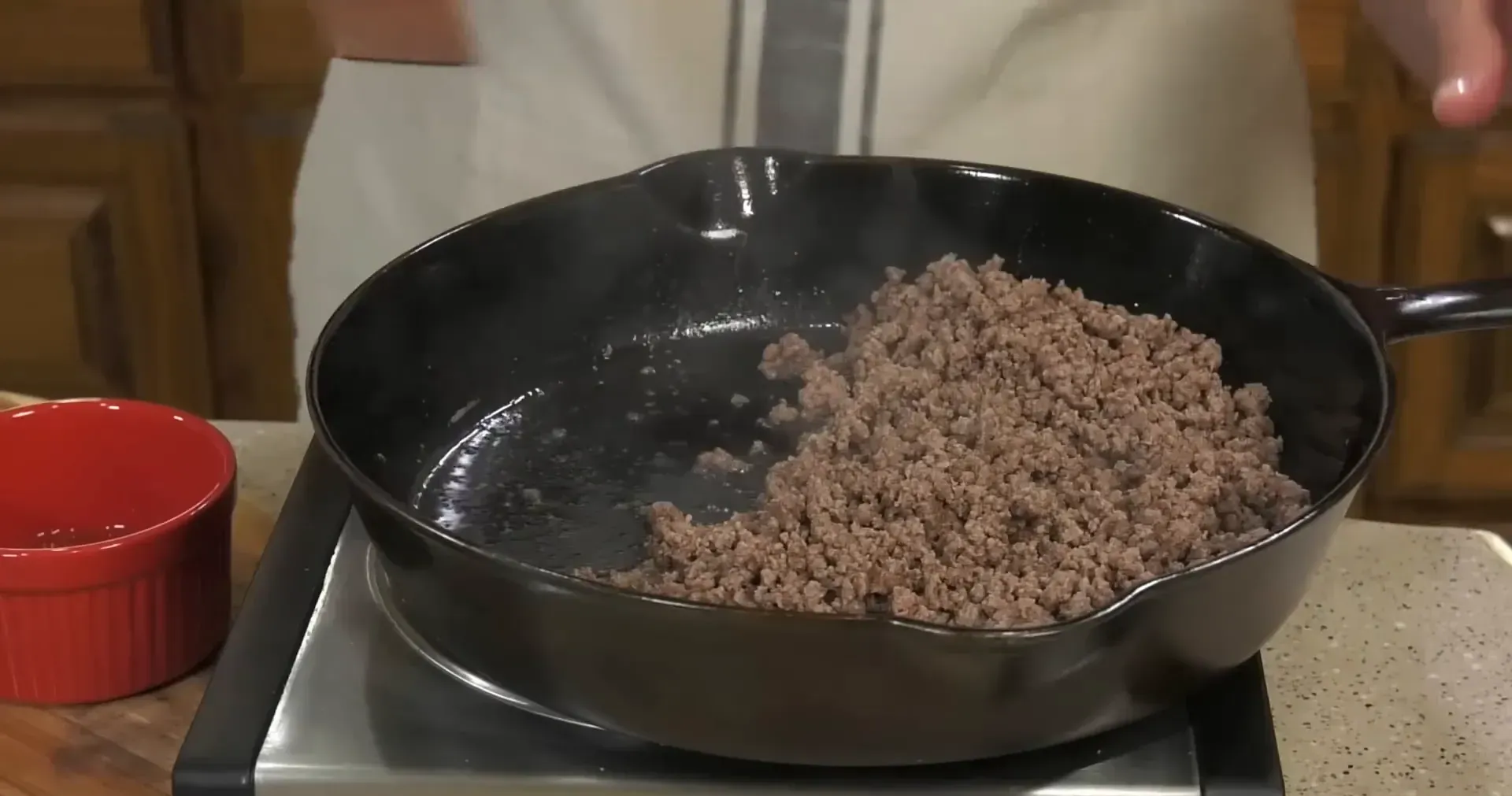 Draining excess grease from the skillet